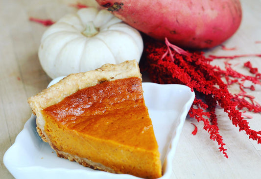 Thick slice of sweet potato pie inside a ramekin