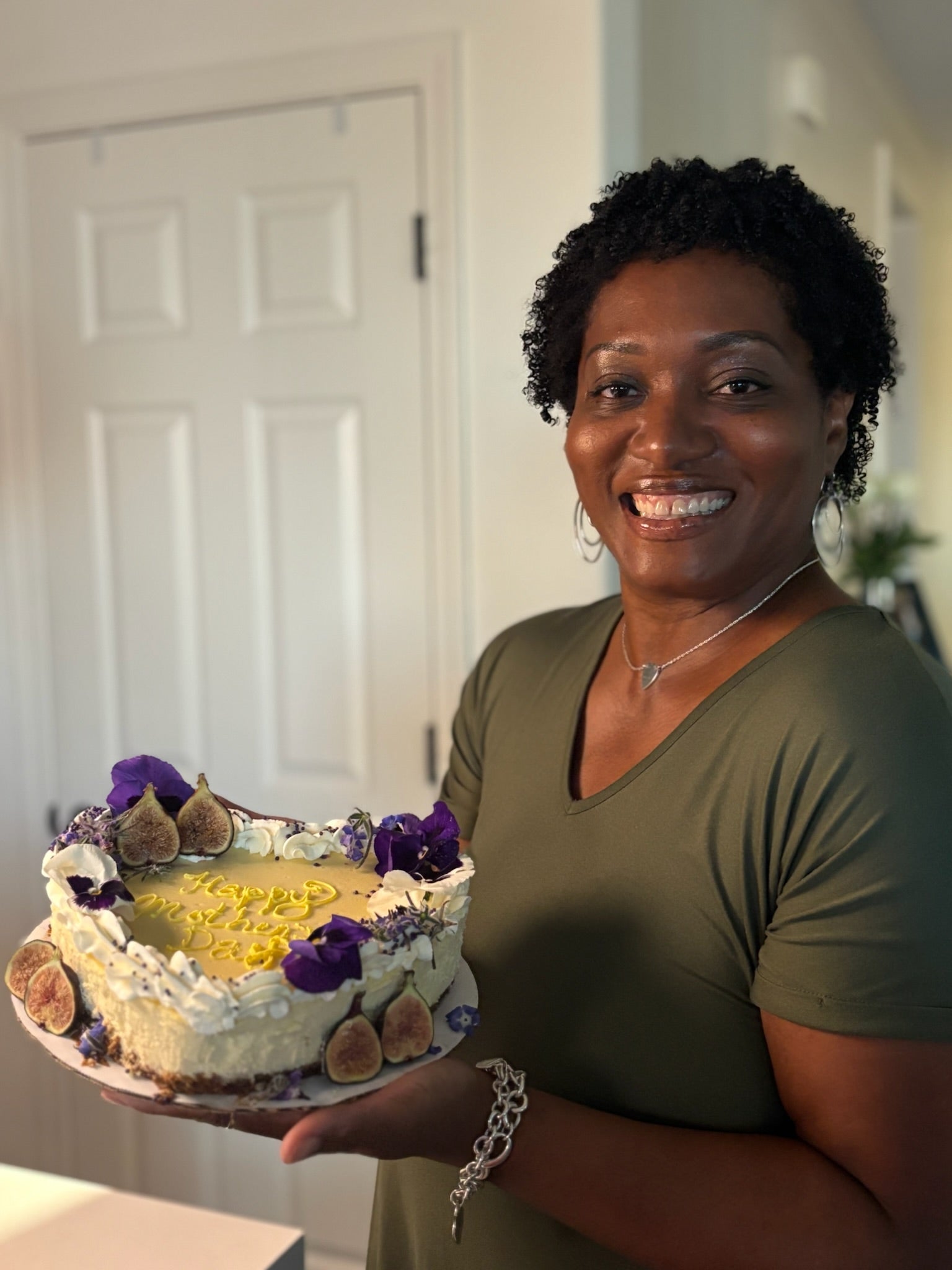 Mom holding 8in Heart cheesecake 